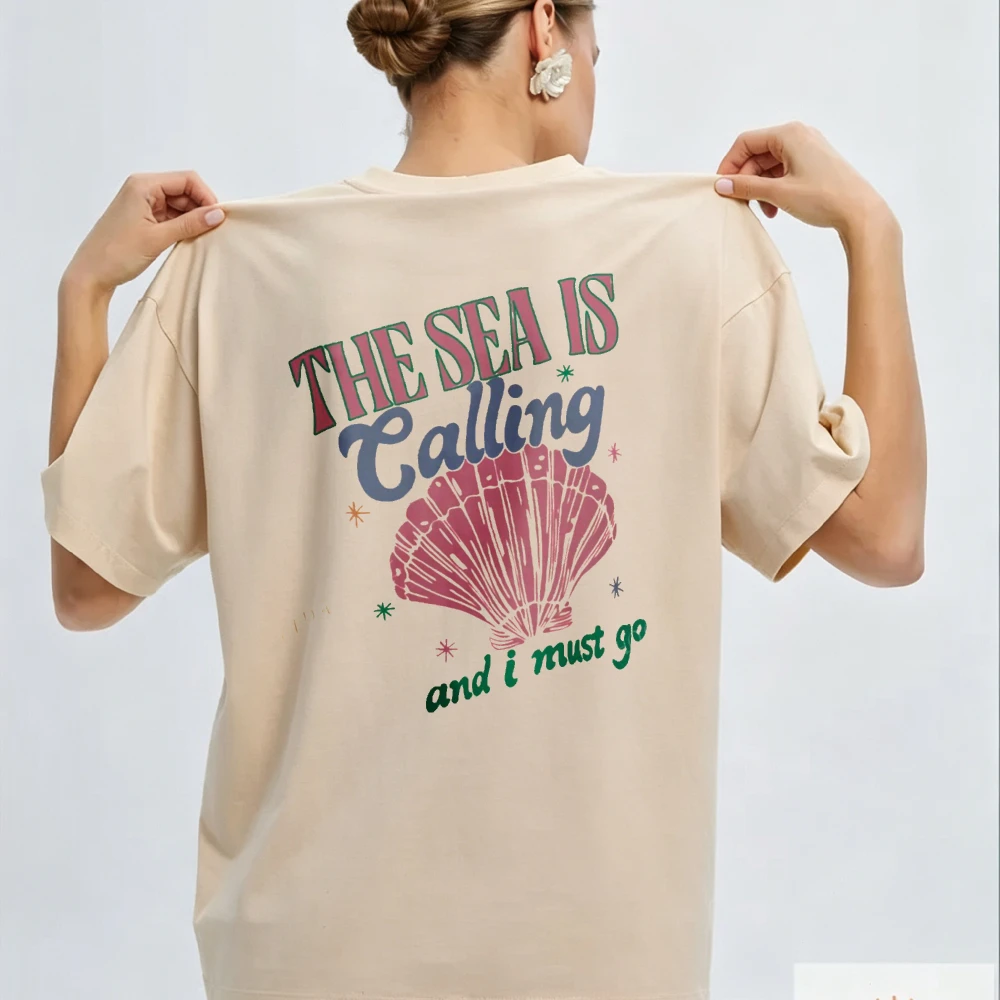 The Sea Is Calling Seashell Boxy Women Tee Coastal Beach Vacation Outfit Soft Cotton Top Casual Summer Seaside Trip Souvenir
