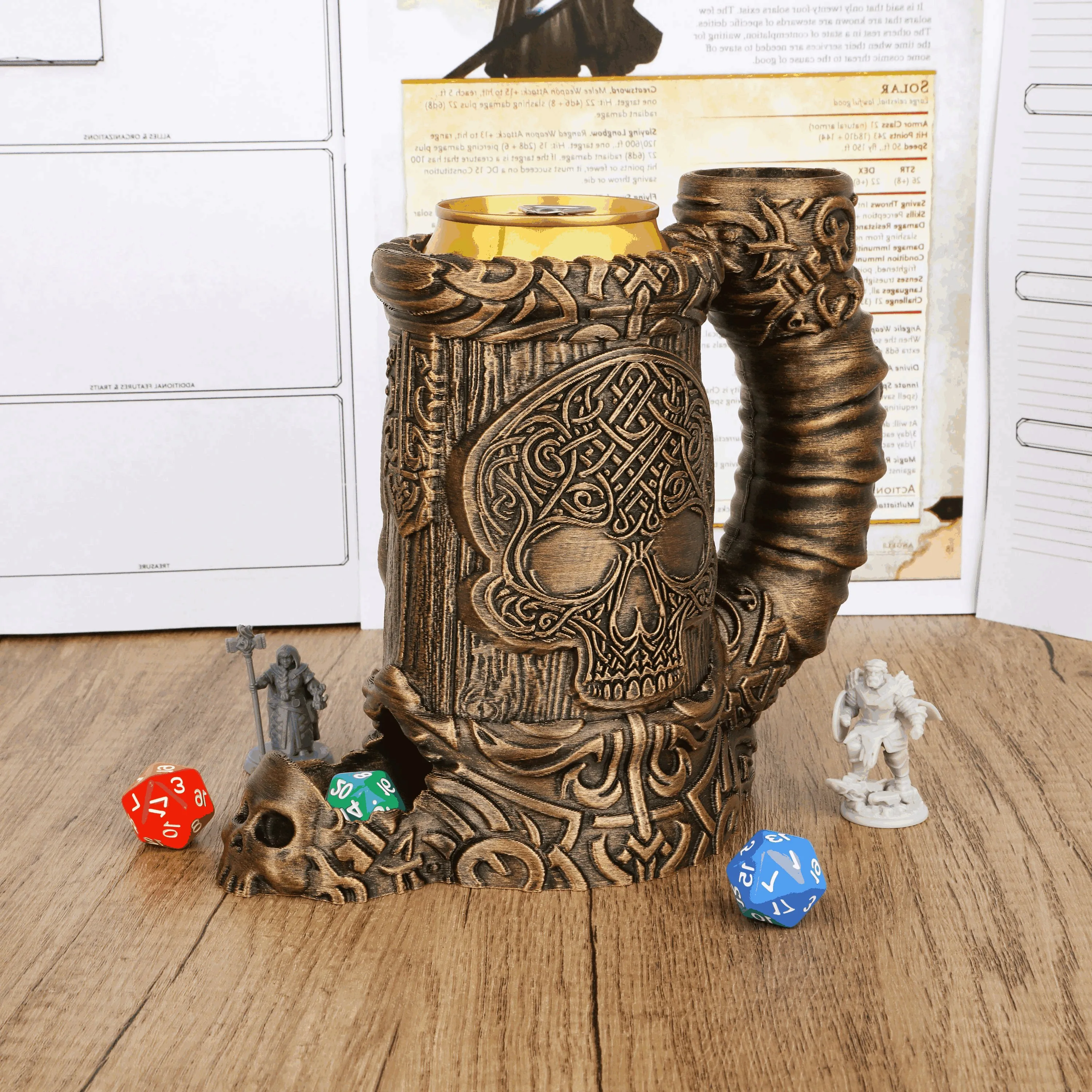 Bronze-coloured dice tower with raised skulls, interlaced patterns, a curved side chute and a skull-shaped exit at the base.