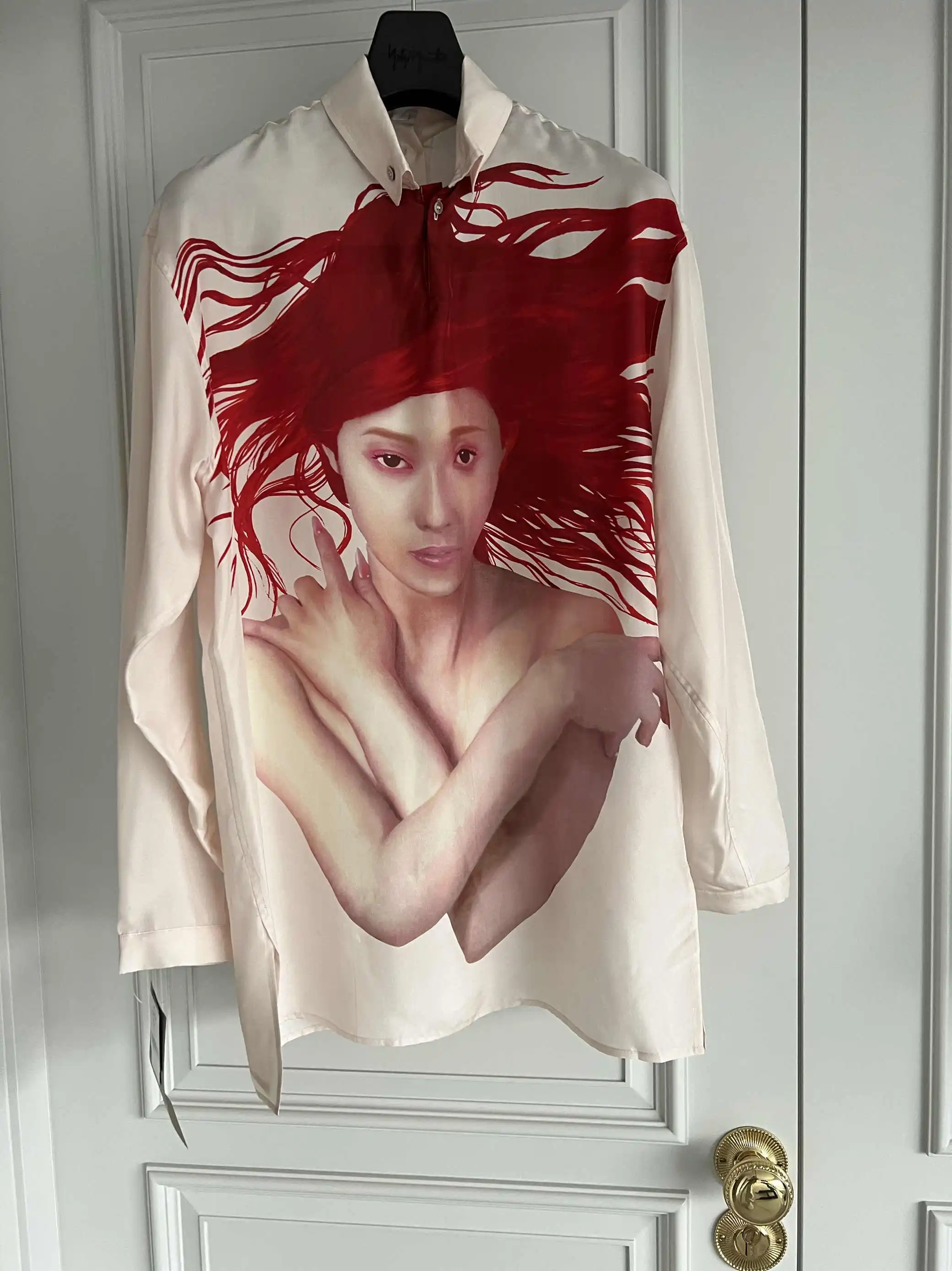 TOP-YAMAMOTO original design: A man with a long-sleeved silk shirt and silhouette featuring the portrait of the Child of the Sun
