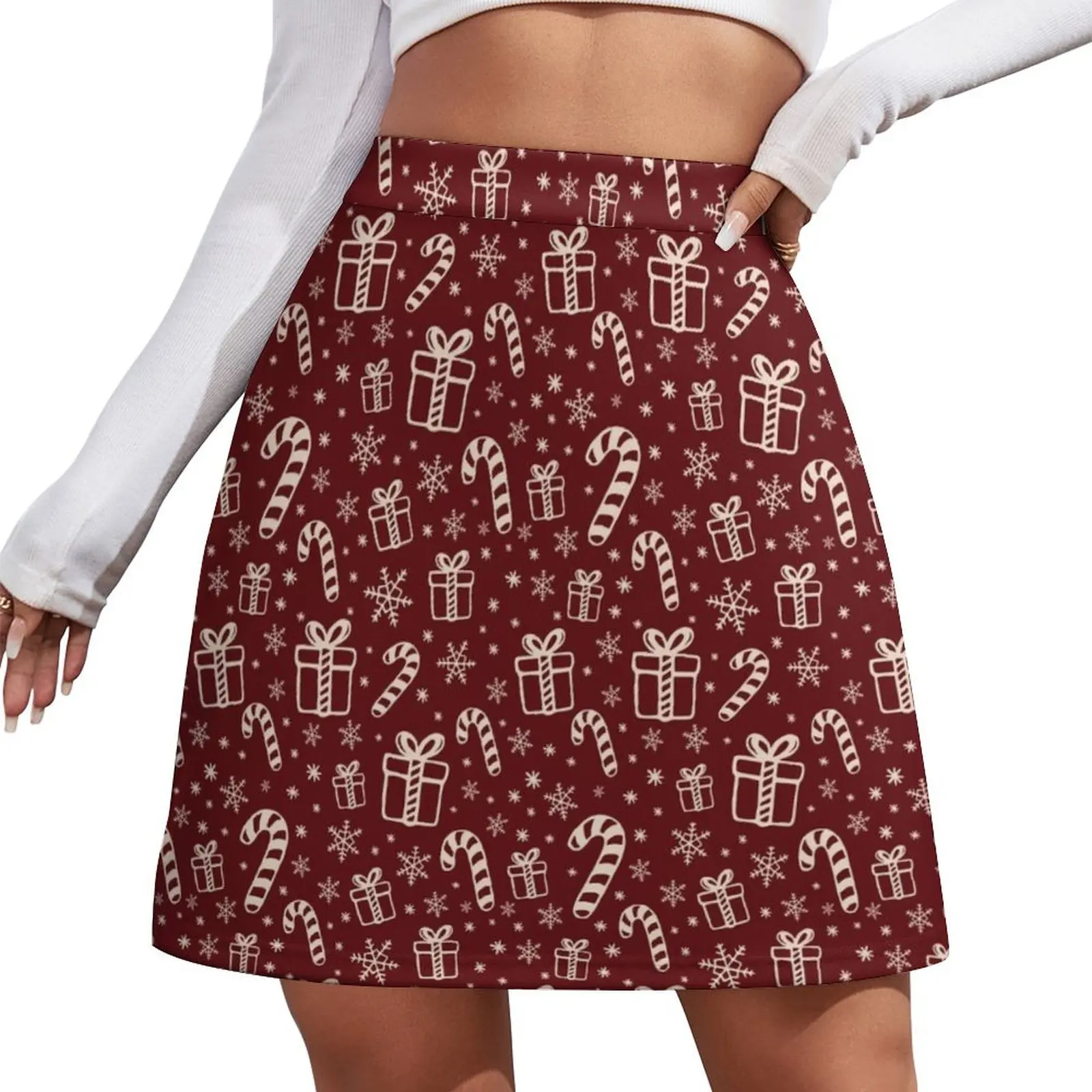 

Seamless Christmas pattern with candy canes, gifts and snowflakes deep red and beige doodle style Mini Skirt Women's skirts