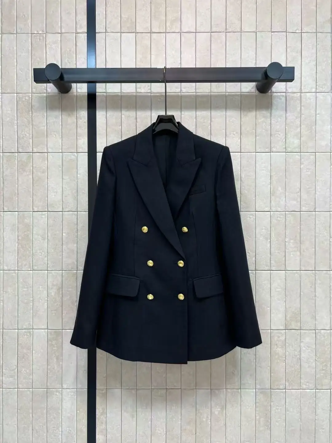 Luxurious slimming waist design for professional wear. Double metal buttons black suit. Business coat with elegant style.