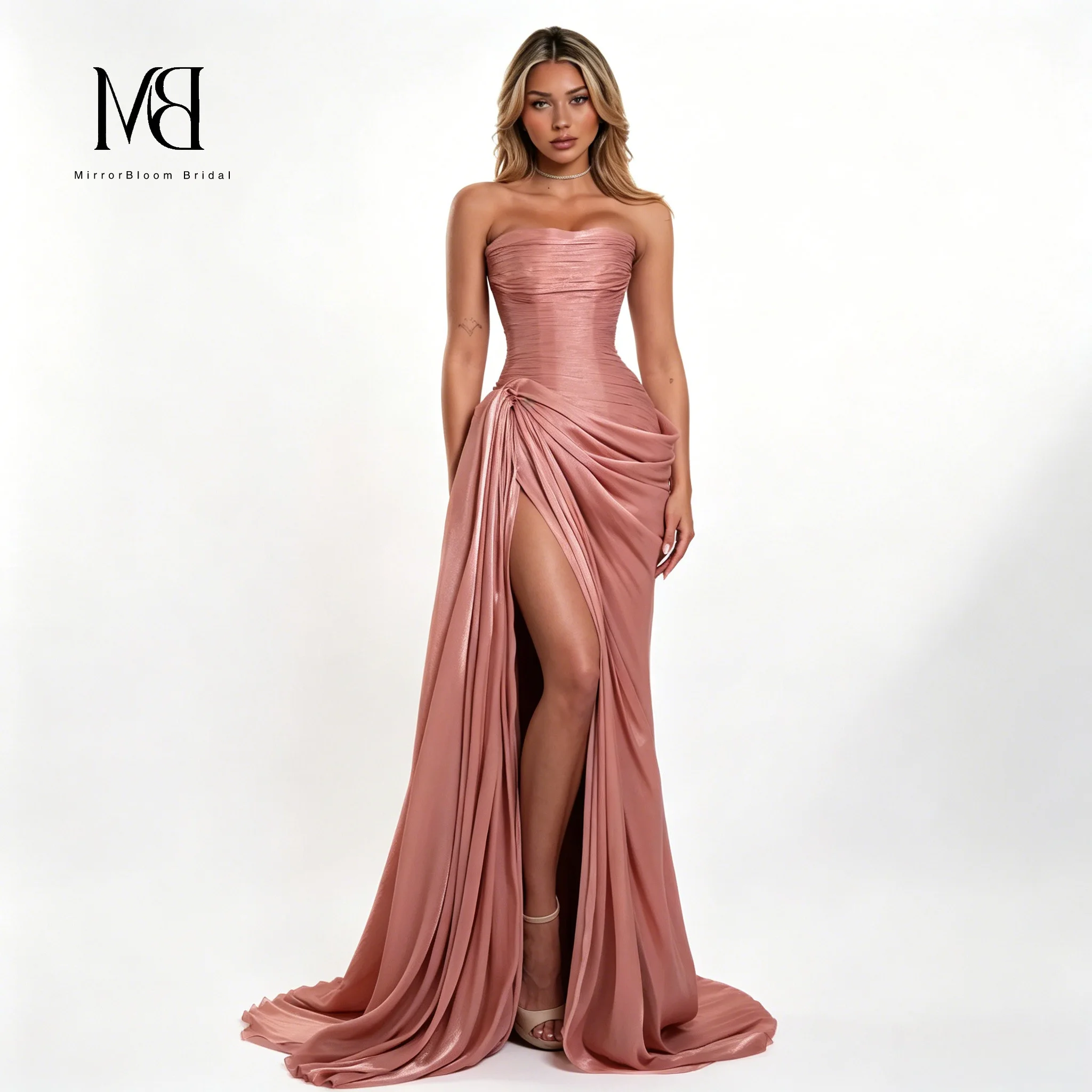 Exquisite blush-pink strapless sleeveless ball gown with a floor-length draped and slit skirt