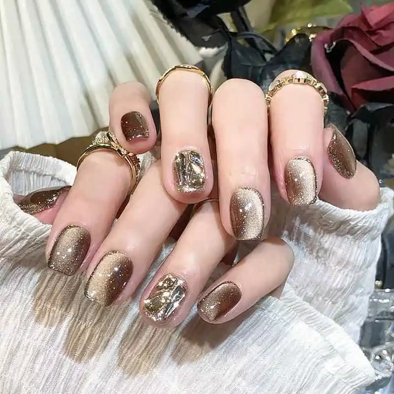 adesivos-de-unha-estilo-novo-outono-inverno-olho-de-Ambar-acucar-preto-e-pontas-de-unha-diamante-dourado-champanhe-tendencia-coreana