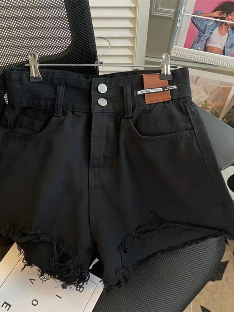 Pantaloncini di jeans a vita alta di grandi dimensioni da donna che dimagriscono pantaloni caldi a trapezio strappati a gamba larga alla moda