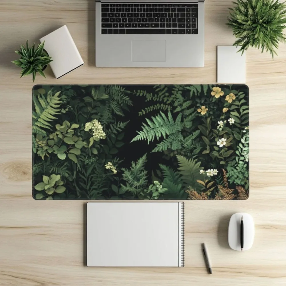 An extremely long rectangular computer keyboard pad featuring patterns of green ferns, leaves and flowers alfombrillas gaming