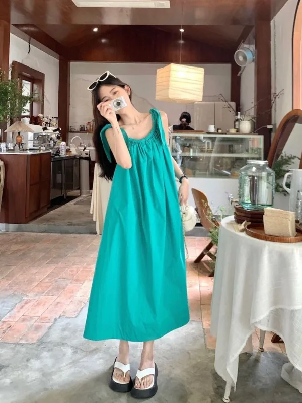 Beach resort solid color suspender dress summer beach skirt French tea break long dress 2024 fashionable women's clothing IP39