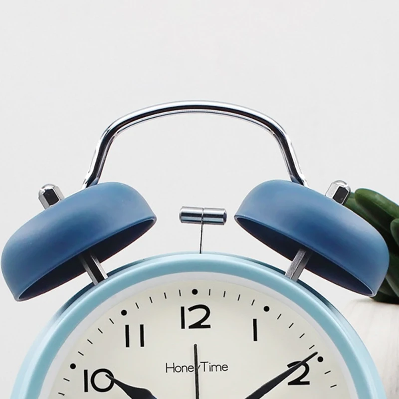 Decorazioni per la casa forniture per studenti cartone animato faccia campana in metallo sveglia comodino silenzioso Sweep secondi orologio da tavolo carino lampada da notte