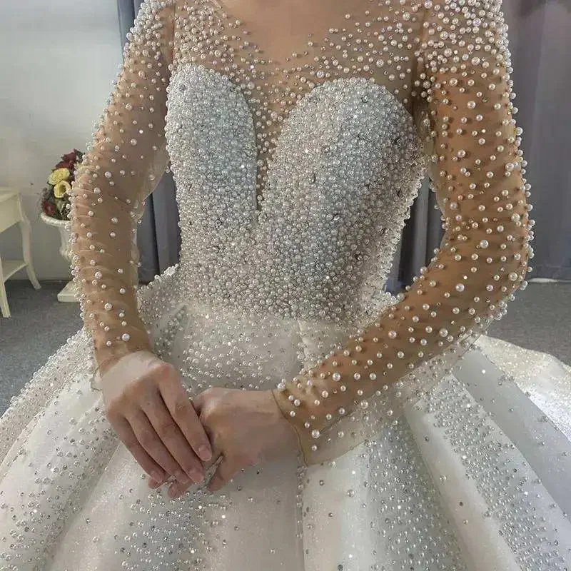 

Customized Customize Fashion Heavy Beaded Pearls Ball Gown Wedding Dresses Long Sleeve Plus Size Africa Shiny Wedding Dress With