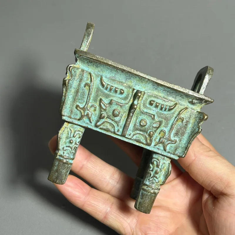 Antique-style green-rusted bronze incense burner with animal face patterns, a collectible piece for home decoration and as a dec