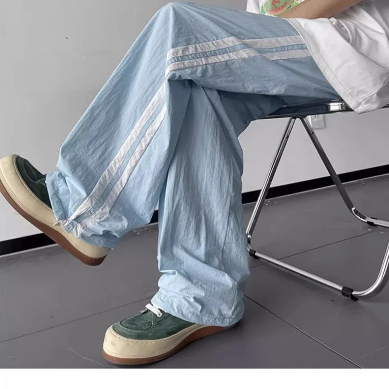 Amerikanische Sommer mode vielseitige dünne Streifen hose Männer solide Patchwork Kordel zug Taschen lose schnell trocknende Sport hose