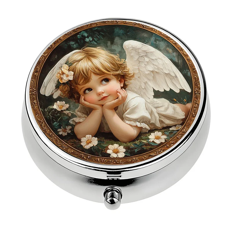 A small pill box with a three-compartment design, featuring an angelic children's theme. This metal pill box is perfect for carrying in a purse or wallet, and can also be used as a travel gift.