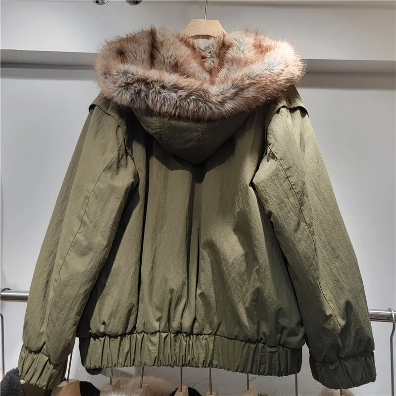 HKSH 2025 شتاء جديد المرأة عكسها معطف دافئ مقنعين فو الفراء سستة جيوب الأمريكية الرجعية أنيق Ins سترة سميكة HK15788