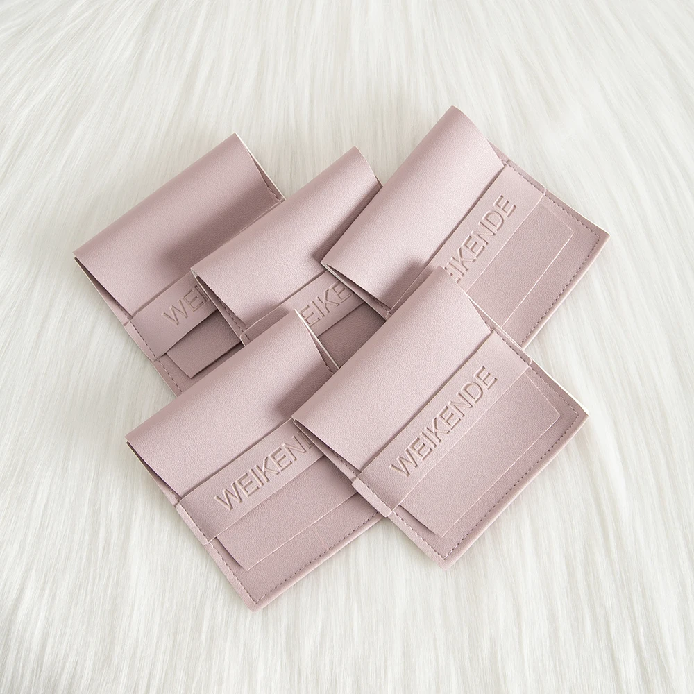 

Light Purple 8x8cm Pu Leather Jewelry Pouch Flip Cover Strip Custom Embossed Logo Ring Necklace Earrings Package Organizer Dust