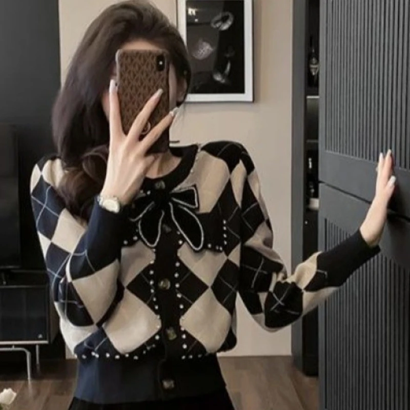 Primavera otoño nueva pequeña fragancia viento reducción de edad suéter tejido hombre pequeño + Falda plisada de tela de lana traje de moda Mujer