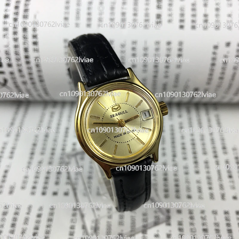 Tianjin Seagull brand yellow shell yellow noodle nail single calendar manual mechanical women's watch, diameter 26mm