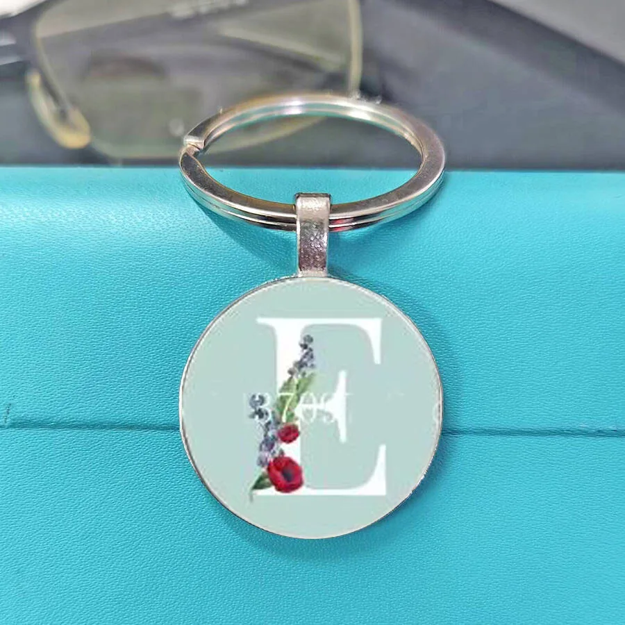 High aesthetic capital letter pattern keychain with gentle and simple design in light green color scheme