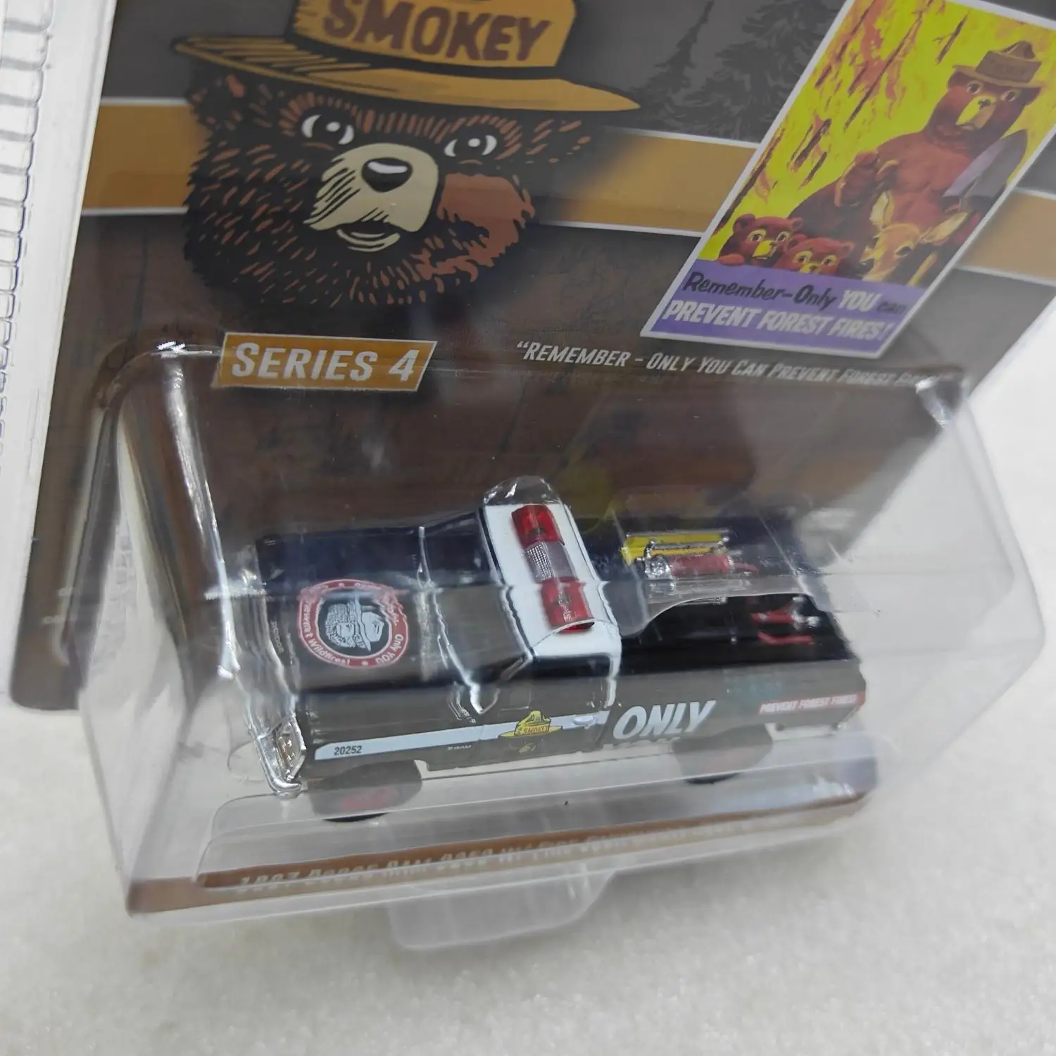 

1: 64 Smoked Bear Series 4-1987 Dodge Ram D250 w/Fire Equipment, Hose and Water Tank Advanced Car Model Collectibles