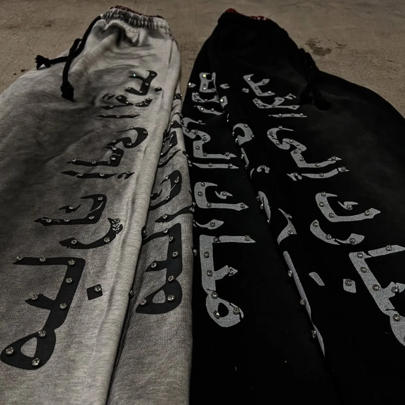 Design de nicho de rua, tendência da moda, calças casuais com estampa de letras versáteis calças de outono e inverno calças de chão de tijolo quente