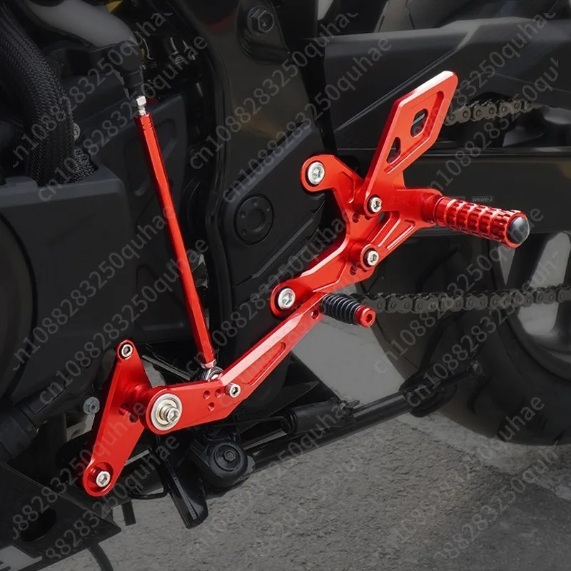 Modified raised pedal rear shift assembly