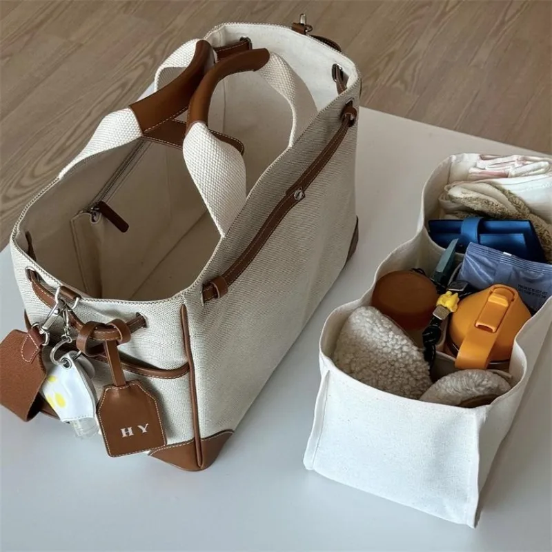

Lightweight portable mommy bag large capacity multifunctional canvas crossbody maternity backpack for breast milk storage