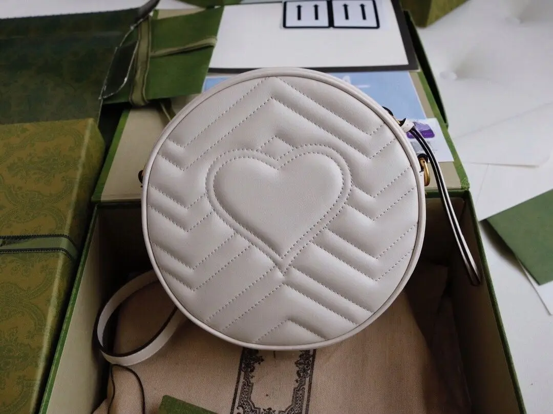 

Круглая мини-сумочка из классической серии Double G, элитный роскошный дизайнерский стиль.YB