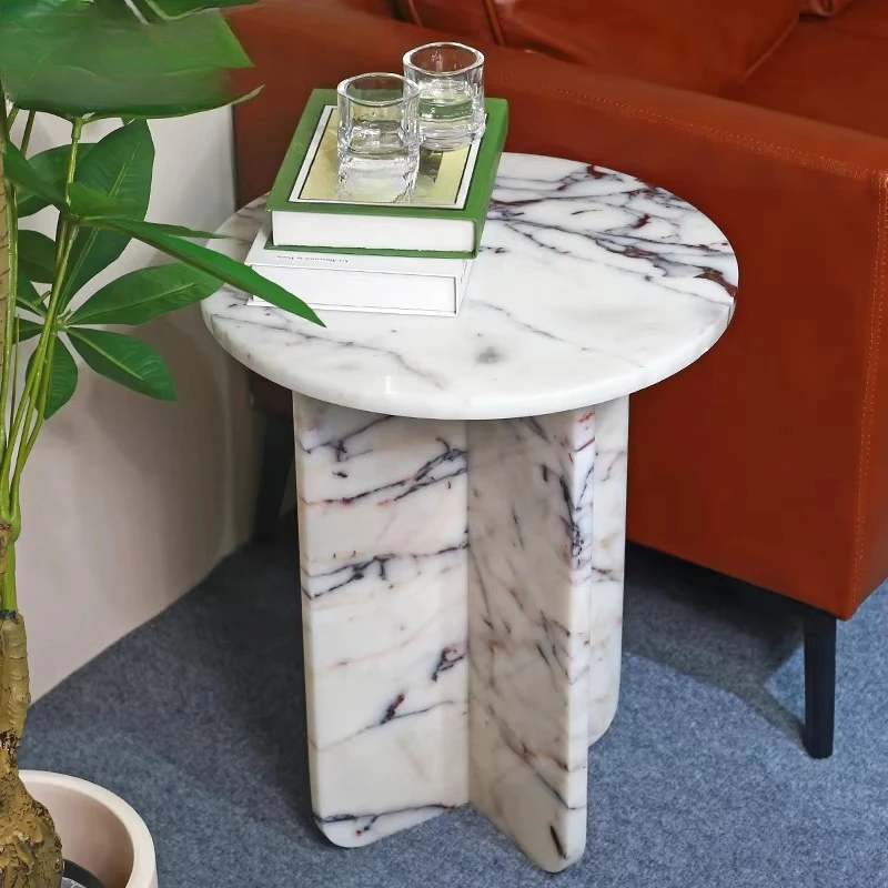 

marble side table with low base cross-shaped legs and rounded top, suitable for apartment villas and mansions