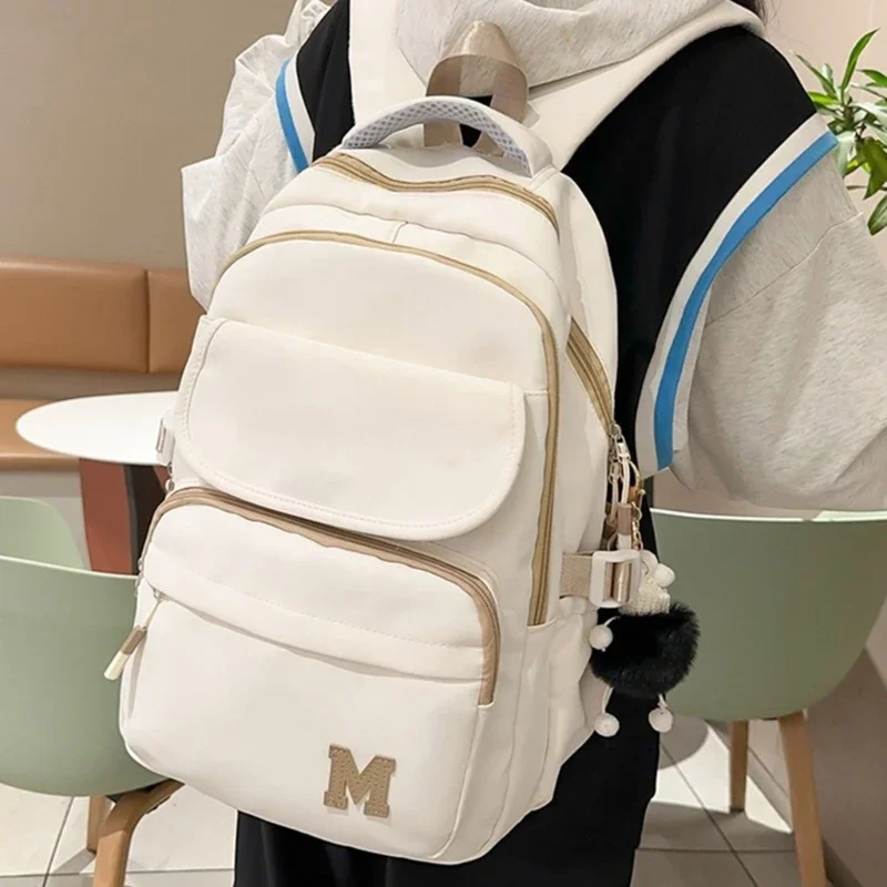 

Unisex Nylon Shoulder Backpack for Trendy Youth Harajuku Letter Schoolbag Large Book Bag for School and Casual Use Wholesale