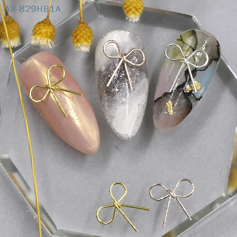 10 stücke 3d Legierung Bowknot Nail Art Charms heiliges Band Bogen Nagel Dekorationen Silber goldenen Nagel Strass DIY Salon Luxus schmuck