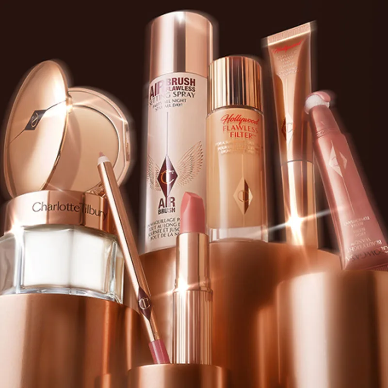 Productos de Belleza Charlotte Tilbury, Lápiz Labial en Tubo Dorado, Colorete, Pre-Maquillaje, Iluminador, Spray Fijador 100ml y 200ml, Polvo Dorado