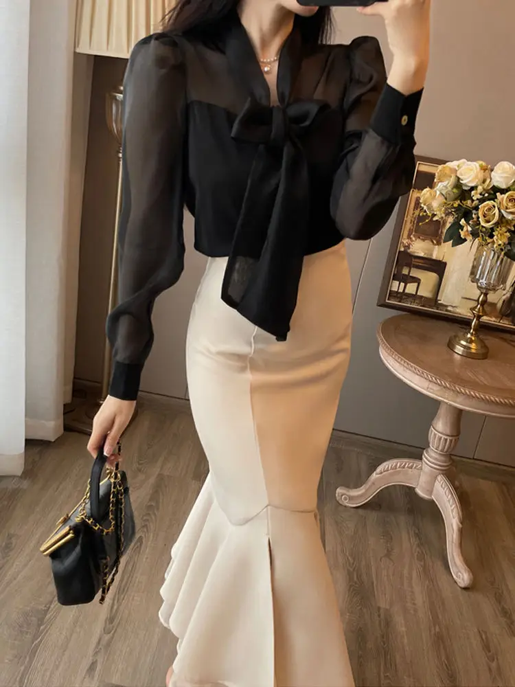 French suit skirt women's early spring 2024 new black long-sleeved shirt high purse hip fishtail skirt two-piece.