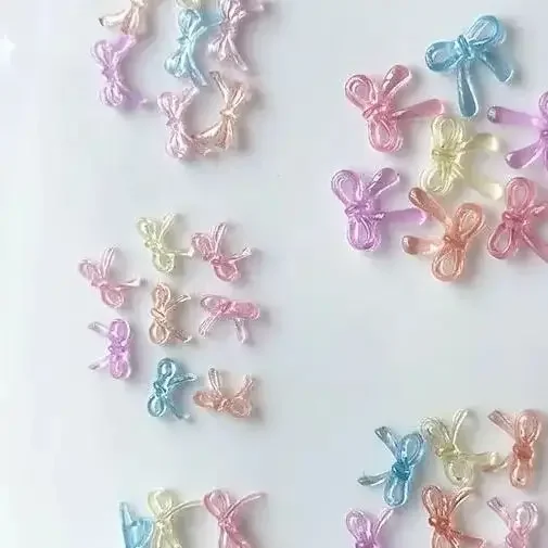 Ruban de couleur Transparent glacé doux, 100 pièces, nœud papillon, outils de décoration pour Nail Art, portant un accessoire en diamant pour Nail Art