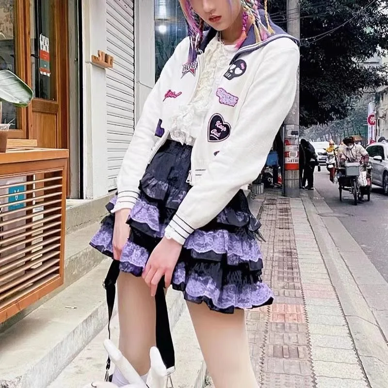 Jupe à carreaux noire violette pour femmes, sous-culture japonaise, couche de rock, mini jupe Harajuku des années 2000, jupe à pompon punk en dentelle