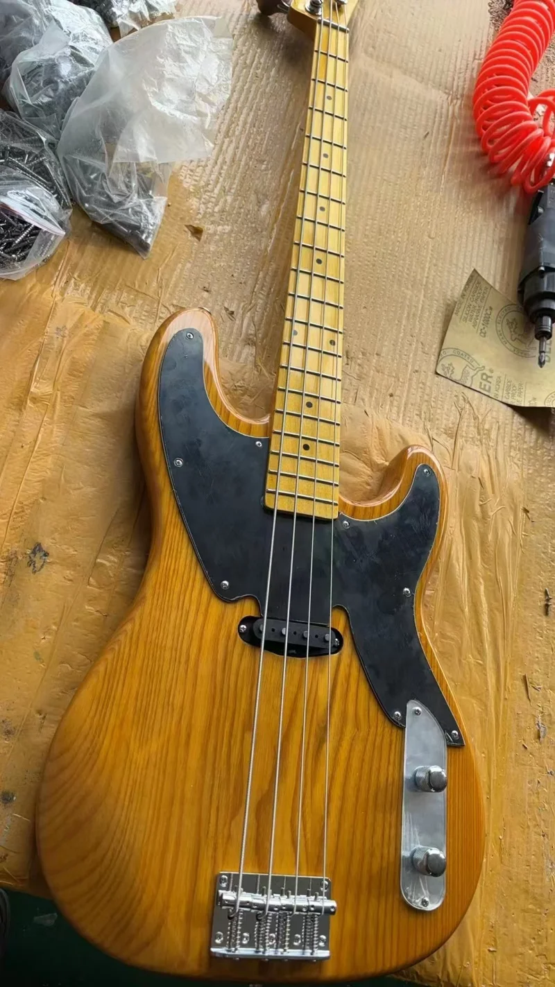 Factory exports high quality 4 string electric bass，Black pickpocket, silver hardware，Solid wood quality，Free delivery
