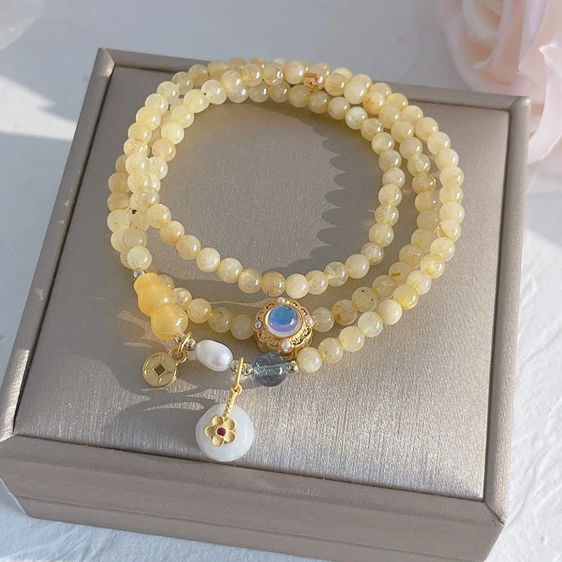 Fu Qi Mantang ~ gold rutilated quartz lucky bracelet yellow hair Crystal peach small flower bracelet niche female gift