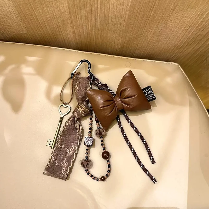 

Vintage Brown Leather Bow Key Pendant Fashion Lace Ribbon Keychain Beading Braided Lanyard Key Ring Suitable for Women Bag
