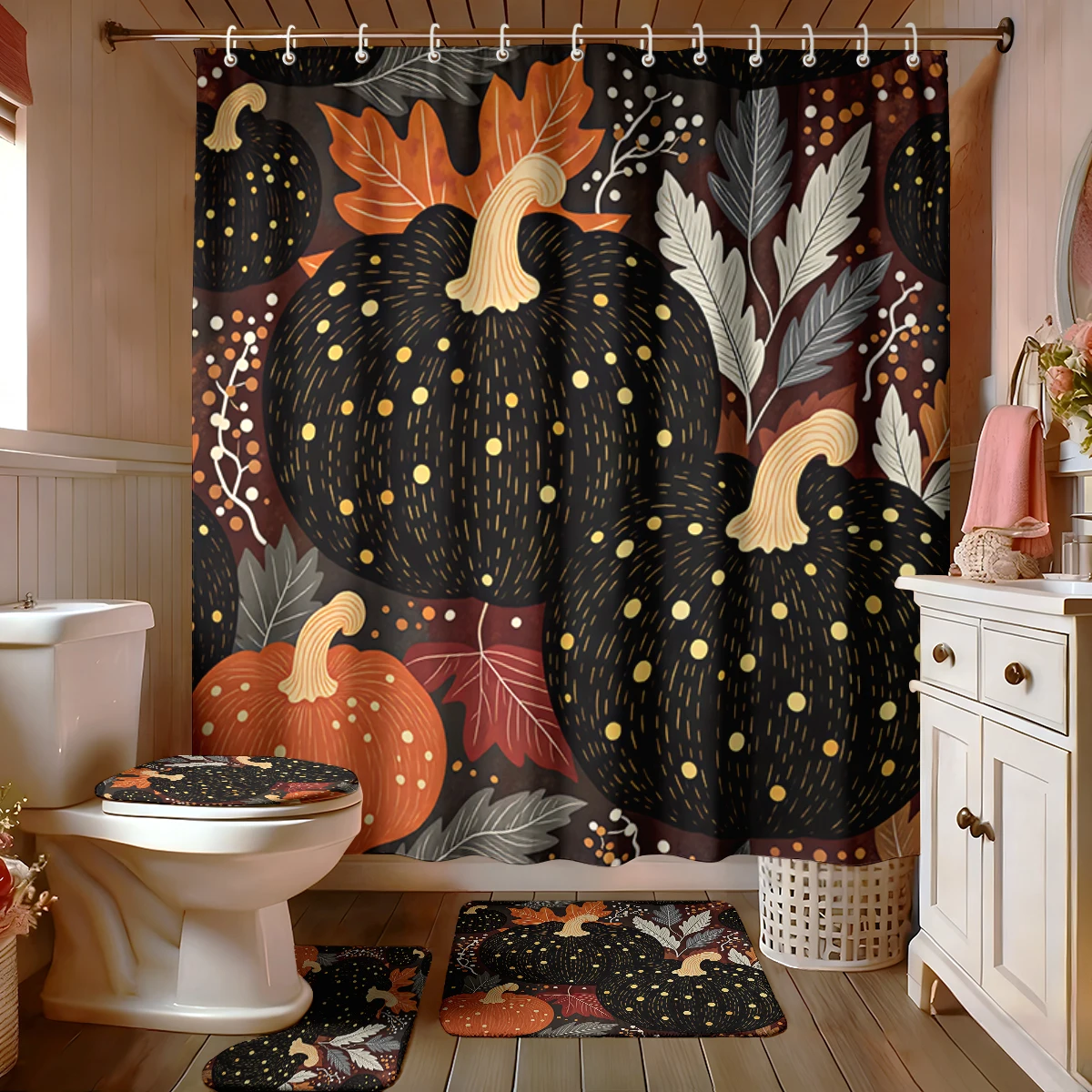 A four-piece bathroom decoration set featuring a black pumpkin and orange leaf pattern, perfect for home decoration.