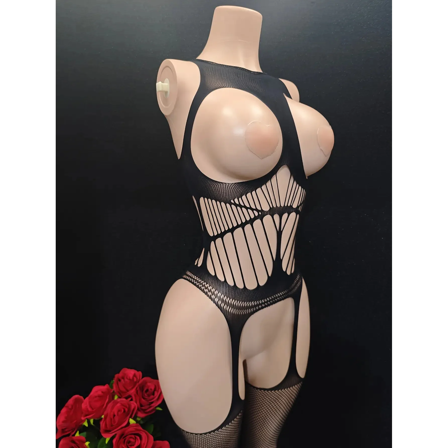 1-Piece Alluring Lace Bodysuit featuring a sheer design with cutouts and see-through mesh, plus fishnet stockings.