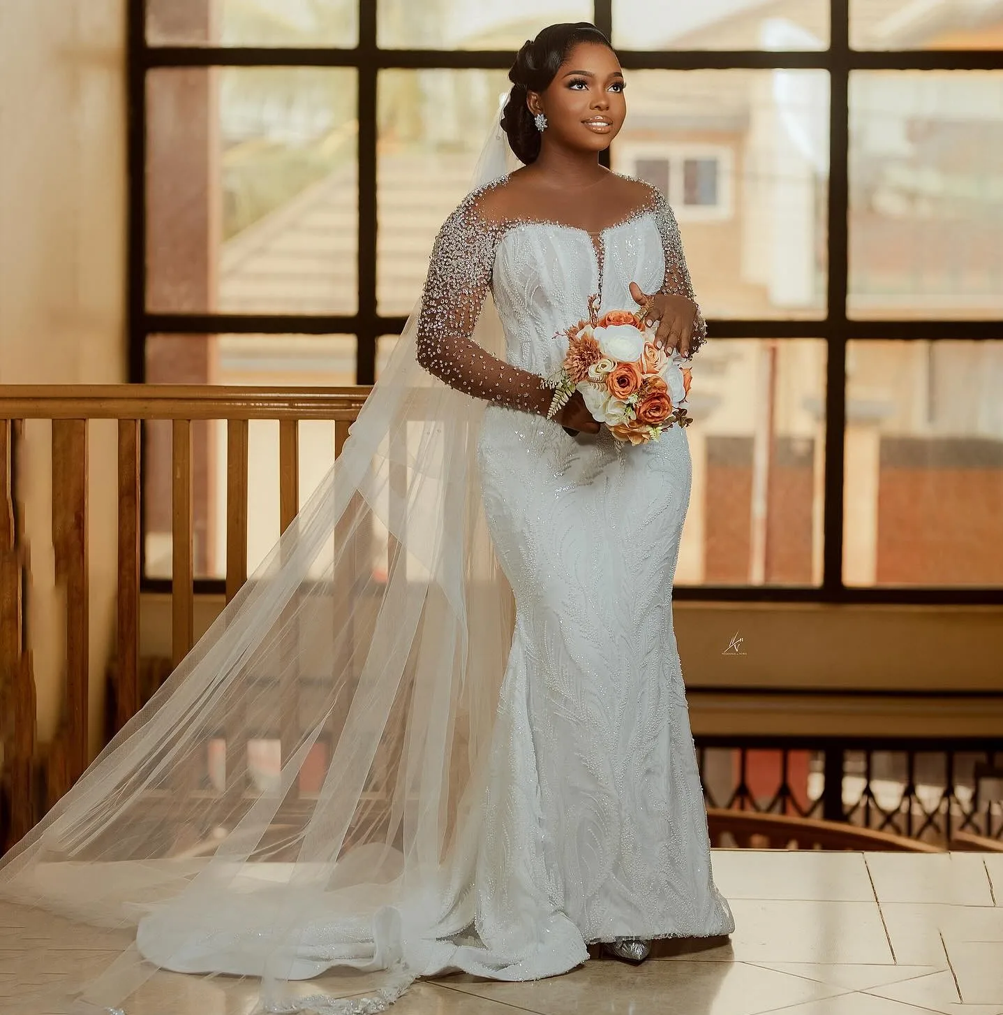 فستان الزفاف الأفريقي 2026 رقبة شفافة وأكمام طويلة خرز ترتر حورية البحر زفاف العروس نمت فيستدوس دي نوفيا #1