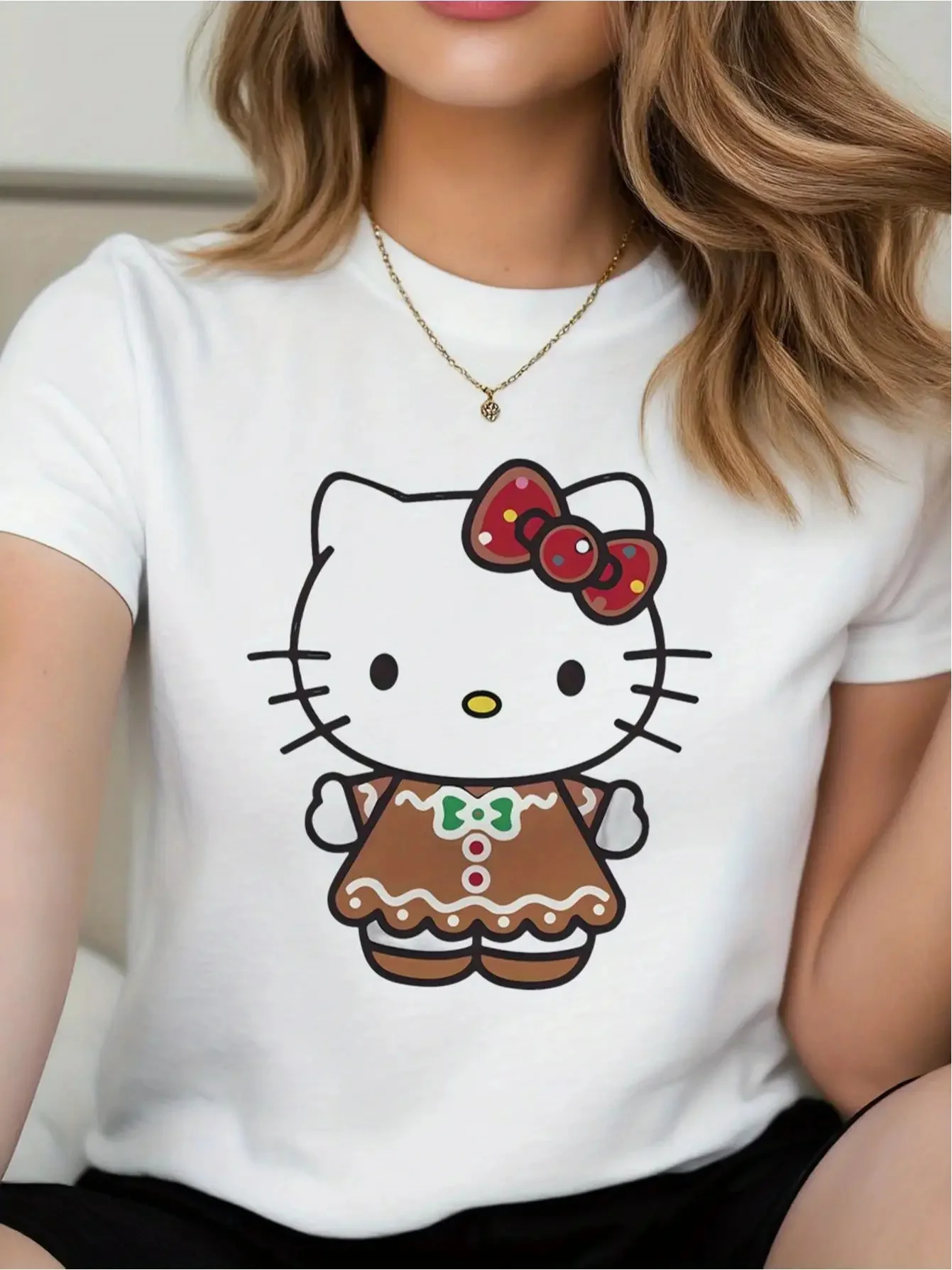 

Sanrio Hello Kitty Women's Christmas T-Shirt - Cute Gingerbread Hello Kitty Print with Heart Bow & Pink Bow