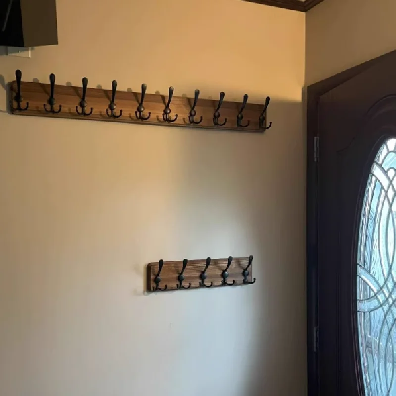 

Vintage-style solid wood wall-mounted coat hook in black, perfectly suited for entryways, hallways, and bedroom home decor