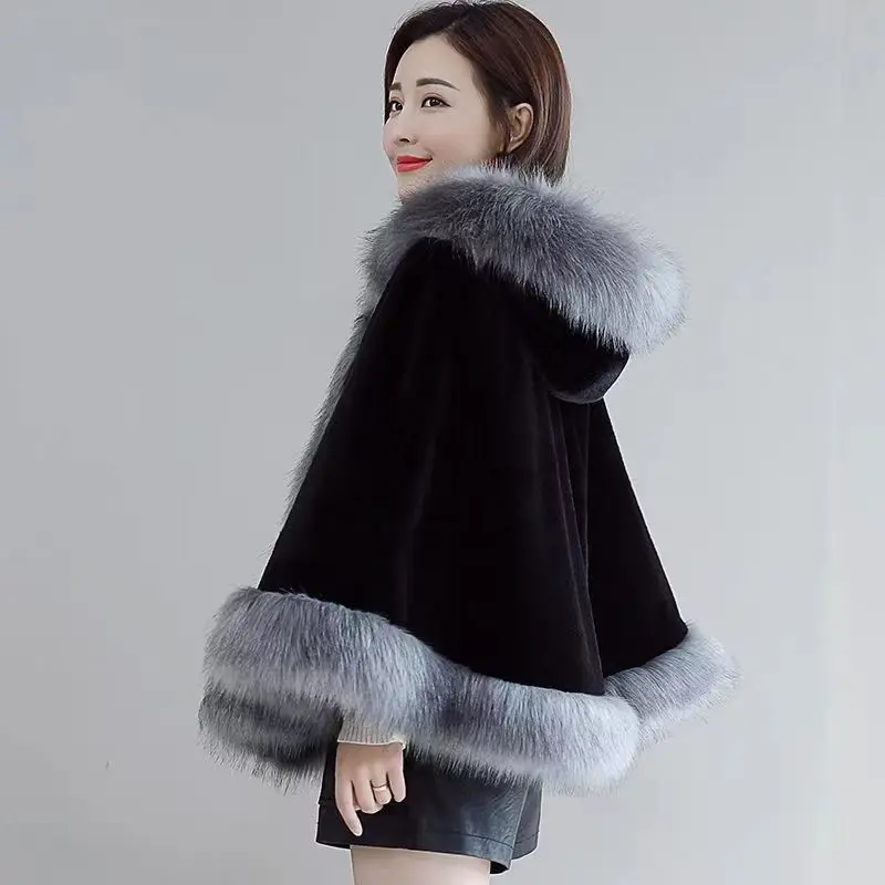 Nouvelle Cape à capuche coréenne hiver châle Outcoat fausse fourrure manteau mi-long fausse fourrure manteau à la mode et chaud pour les femmes vêtements pour femmes
