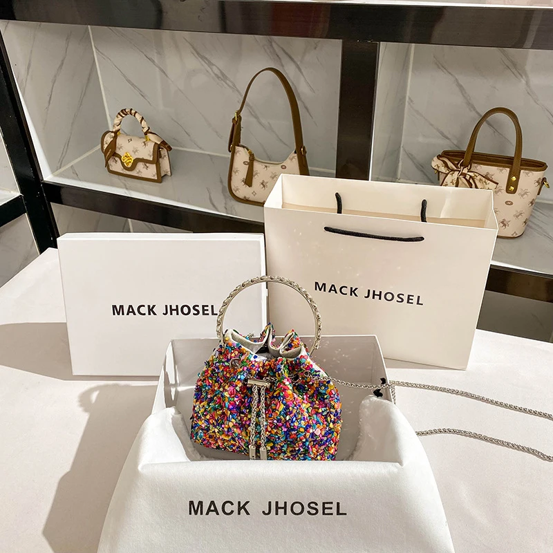 

This year's popular sequin and rhinestone bag with tassels and chain handle