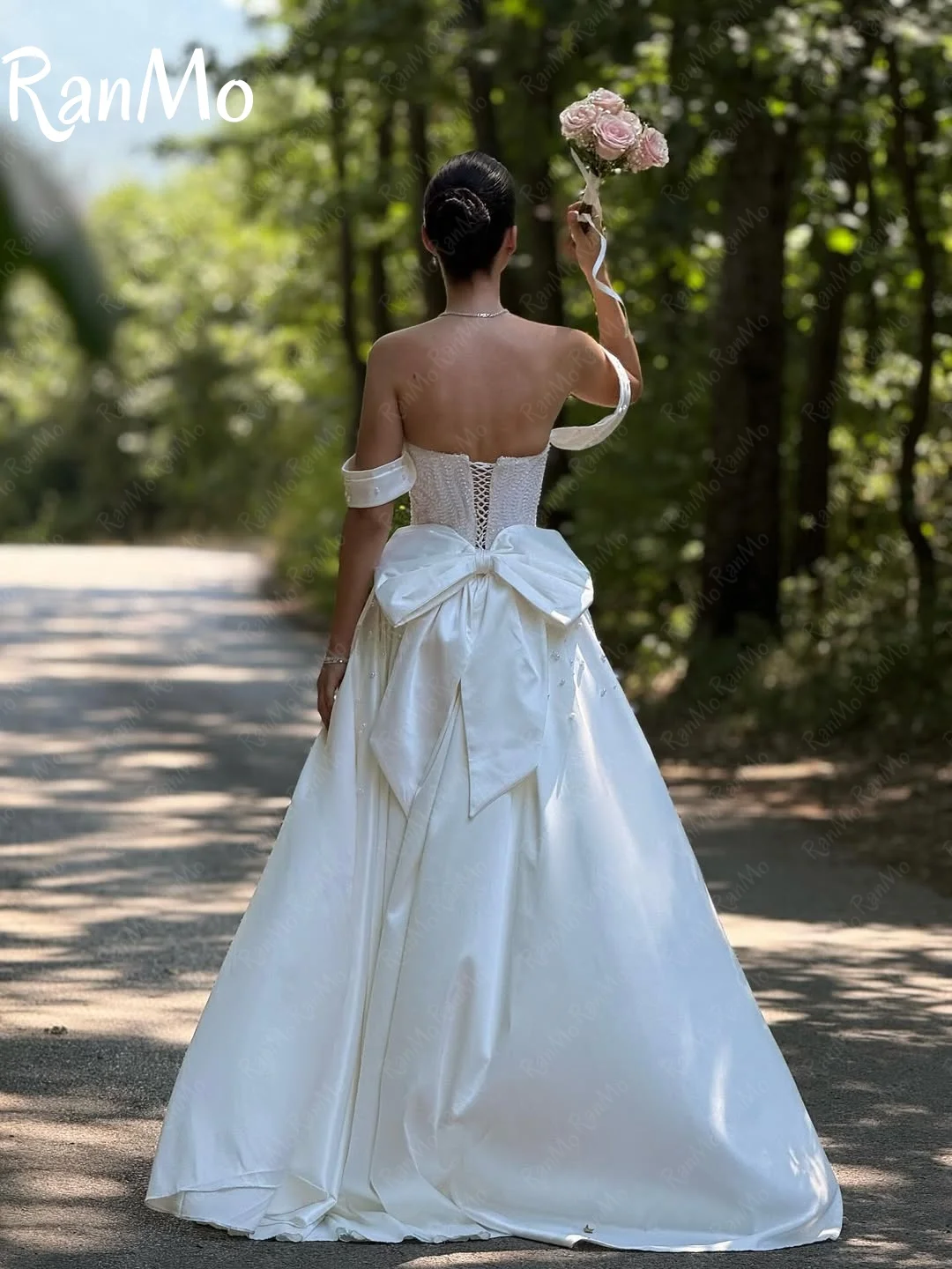 Ranmo جديد 2025 فستان زفاف فاخر على شكل قلب بدون أكتاف مطرز بفيونكة دانتيل Vestido de novia فستان زفاف لؤلؤي مشد مخصص