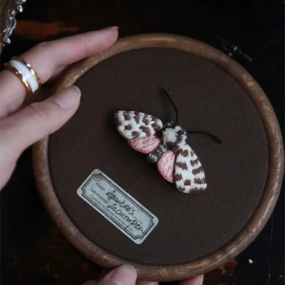 A delicate and exclusive pink three-dimensional butterfly DIY embroidery kit. The kit comes with a video tutorial and an English