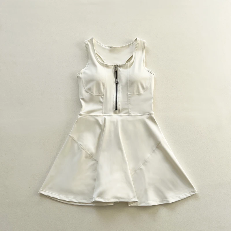Sleeveless, waist-cinched women's tennis skirt, athletic dress with built-in bra pads and shorts with zipper fly