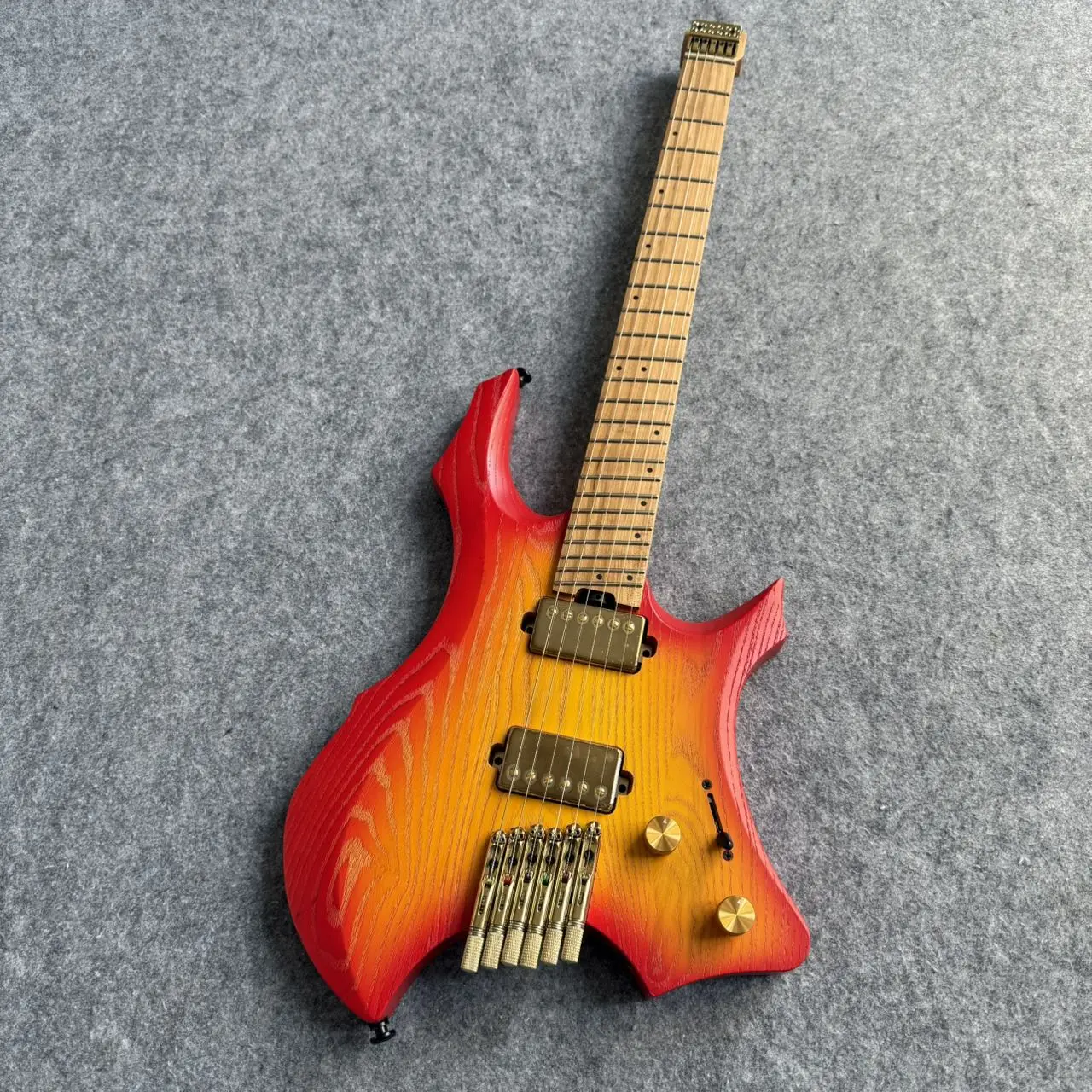 

2026 HOT 24 Frets Headless 6 String Red-orange Colour Guitar，White Wax Wood Body, maple Fingerboard Pro Guitar