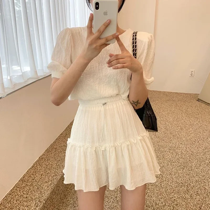 

South korea Chic Summer Simple Temperament Particle Sense Puff sleeve Top + High Waist Wooden Ear Skirt Two-piece Set