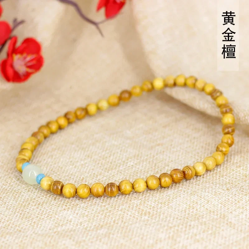 

Gold sandalwood DIY emerald bracelet 0.8×45 hand string men and women's literary decoration beads Buddha beads manufacturers