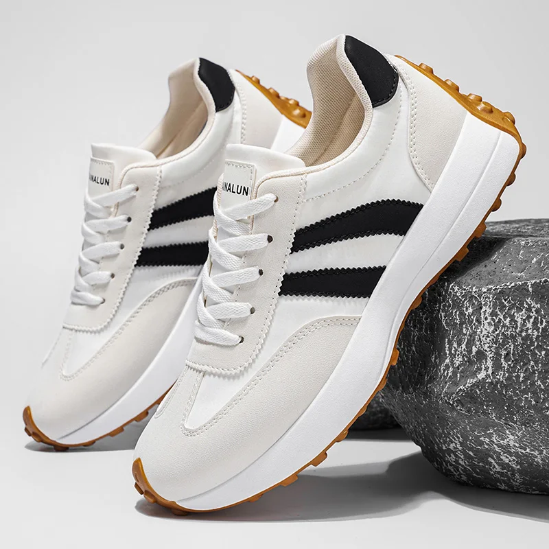 A pair of men's spring casual sports shoes. Striped design on the upper. Thickened, wear-resistant and highly scratch-resistant