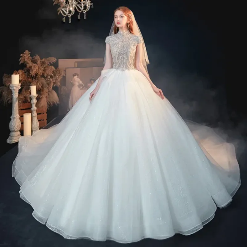 

2025 White Wedding Dress High Neck Design Short Sleeved Pearl And Sequin Large Skirt Backless Gorgeous Dreamy Customization